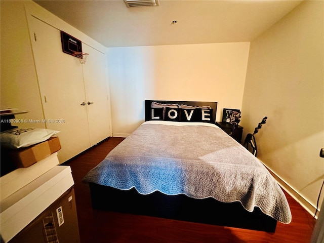 9066 SW 73rd Ct Unit 1409, Miami, FL 33156 - bedroom featuring dark wood-style floors and a closet