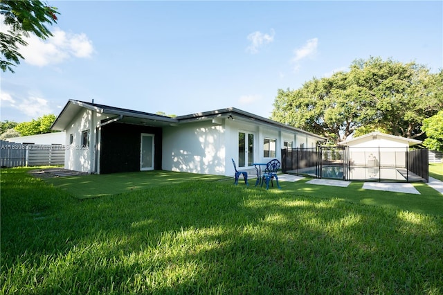 10860 SW 116th St, Miami, FL 33176 - rear view of property with stucco siding and a fenced backyard