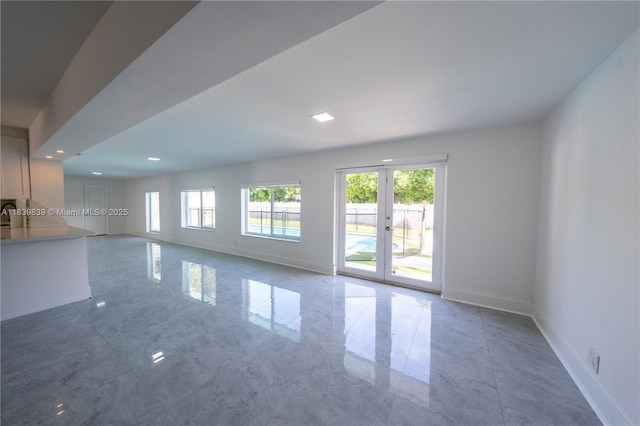 10860 SW 116th St, Miami, FL 33176 - unfurnished living room with plenty of natural light, french doors, and recessed lighting