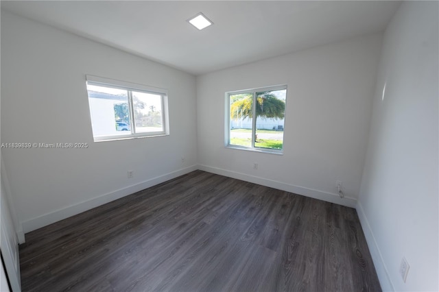 10860 SW 116th St, Miami, FL 33176 - empty room with dark wood-style floors and baseboards