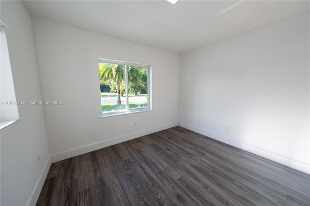 10860 SW 116th St, Miami, FL 33176 - empty room featuring dark wood-style flooring and baseboards