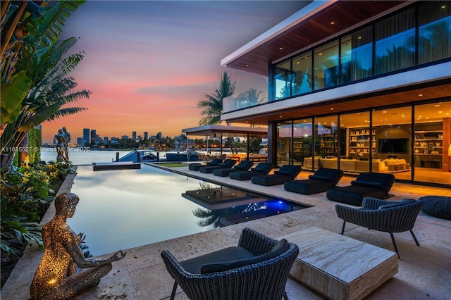 126 W San Marino Dr, Miami Beach, FL 33139 - view of pool featuring a patio area, a view of city, an outdoor hangout area, and a bocce ball area