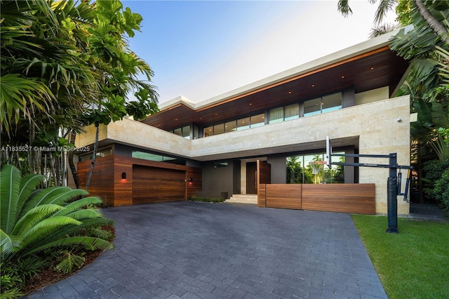 126 W San Marino Dr, Miami Beach, FL 33139 - contemporary house featuring decorative driveway and a garage