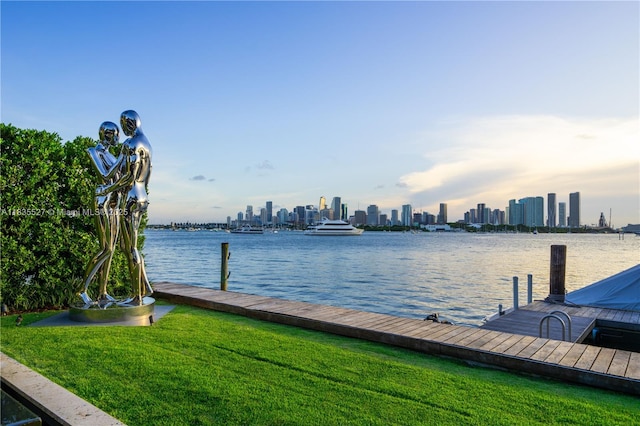 126 W San Marino Dr, Miami Beach, FL 33139 - dock featuring a yard, a water view, and a view of skyline