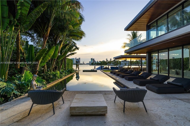 126 W San Marino Dr, Miami Beach, FL 33139 - view of patio terrace at dusk