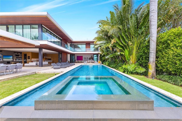 126 W San Marino Dr, Miami Beach, FL 33139 - swimming pool with an in-ground hot tub, an outdoor living space, and a patio