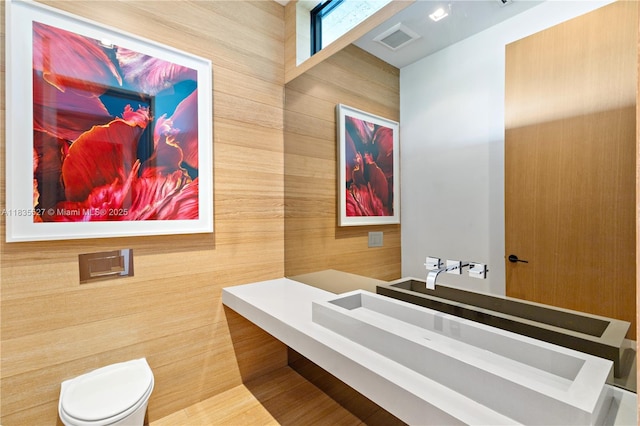 126 W San Marino Dr, Miami Beach, FL 33139 - half bath featuring toilet and tile walls