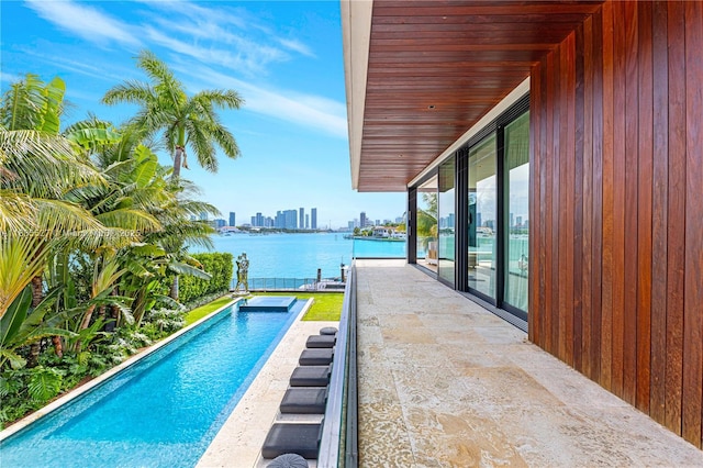 126 W San Marino Dr, Miami Beach, FL 33139 - outdoor pool with a water view, a patio, and a skyline view