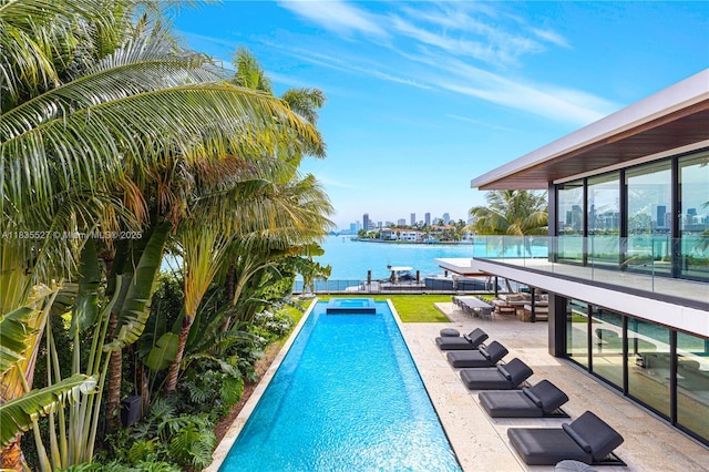 126 W San Marino Dr, Miami Beach, FL 33139 - swimming pool featuring a patio area, a water view, and a dock