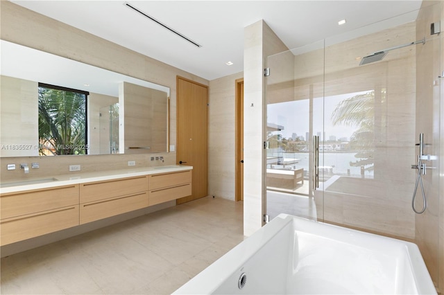 126 W San Marino Dr, Miami Beach, FL 33139 - full bathroom featuring double vanity, a walk in shower, and a water view