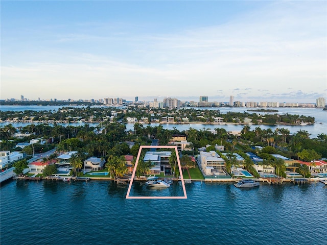 126 W San Marino Dr, Miami Beach, FL 33139 - aerial view of property's location featuring city skyline, property boundaries highlighted, and a large body of water