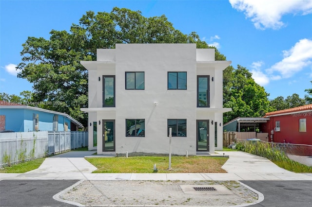 1271 NW 38th St, Miami, FL 33142 - modern home featuring stucco siding