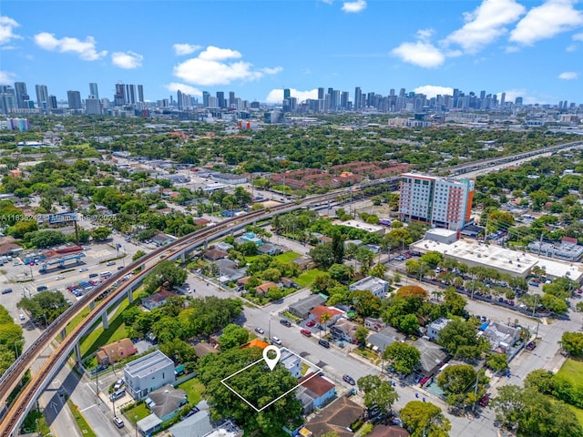 1271 NW 38th St, Miami, FL 33142 - aerial view of property and surrounding area with skyline and property boundaries highlighted