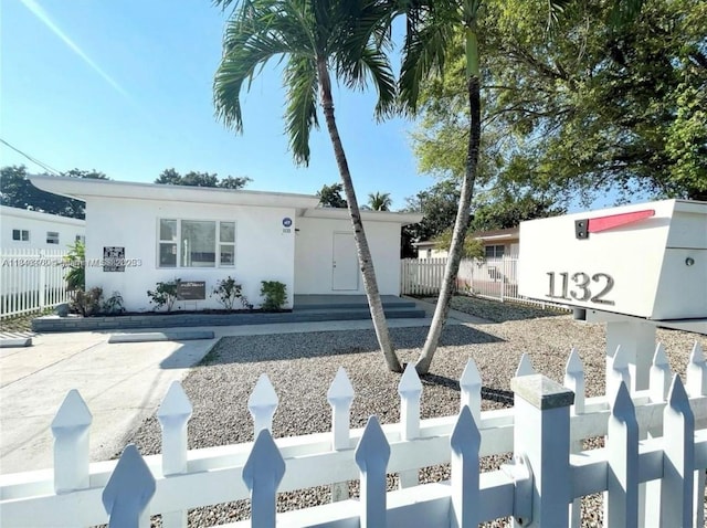 1130 NE 111th St, Biscayne Park, FL 33161 - view of front of house featuring stucco siding