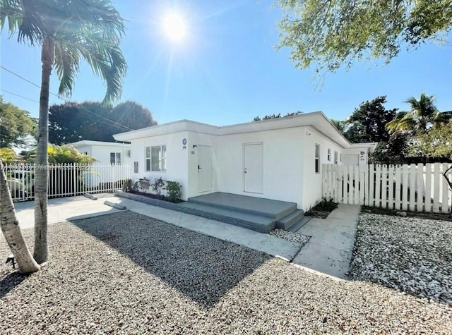 1130 NE 111th St, Biscayne Park, FL 33161 - rear view of property featuring stucco siding