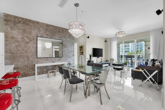 200 Sunny Isles Blvd Unit Th-404, Sunny Isles Beach, FL 33160 - dining space with a chandelier, wallpapered walls, and tile patterned floors
