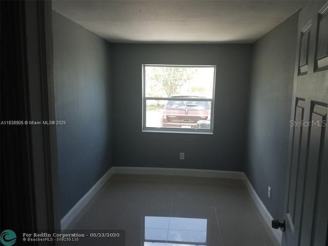 1610 S 22nd Ave, Hollywood, FL 33020 - spare room featuring tile patterned floors and baseboards