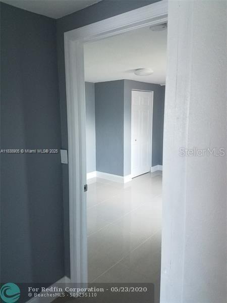1610 S 22nd Ave, Hollywood, FL 33020 - corridor with baseboards