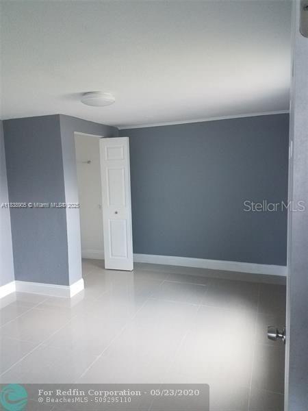 1610 S 22nd Ave, Hollywood, FL 33020 - tiled spare room with baseboards