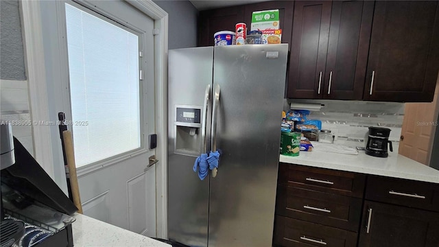 1610 S 22nd Ave, Hollywood, FL 33020 - kitchen with stainless steel refrigerator with ice dispenser, light countertops, tasteful backsplash, and dark brown cabinets