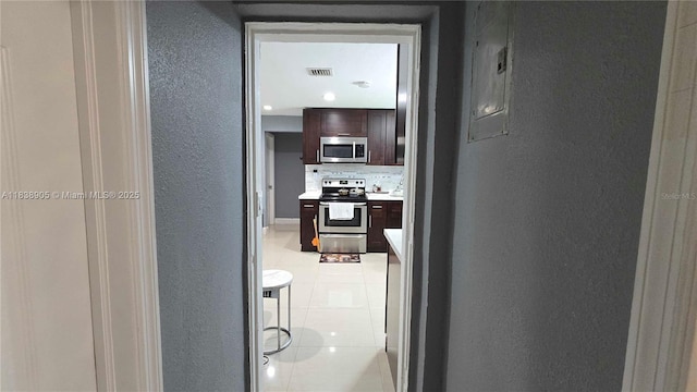 1610 S 22nd Ave, Hollywood, FL 33020 - hallway featuring a textured wall and light tile patterned floors