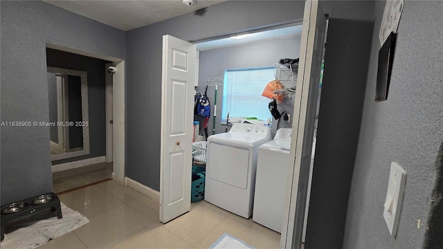 1610 S 22nd Ave, Hollywood, FL 33020 - laundry room with washer and dryer and light tile patterned flooring