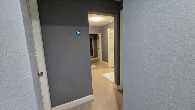 1610 S 22nd Ave, Hollywood, FL 33020 - corridor featuring tile patterned flooring and a textured wall