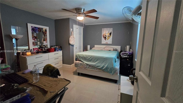 1610 S 22nd Ave, Hollywood, FL 33020 - bedroom featuring light tile patterned flooring, a ceiling fan, and ornamental molding