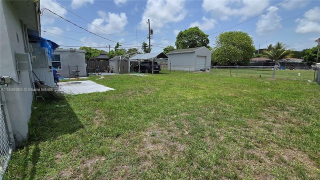 1610 S 22nd Ave, Hollywood, FL 33020 - fenced backyard with a storage unit and a patio area