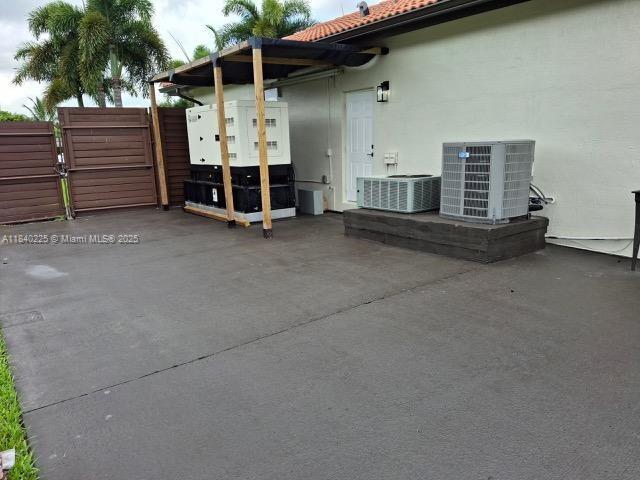 16961 SW 213th Ln, Miami, FL 33187 - view of patio / terrace featuring a gate