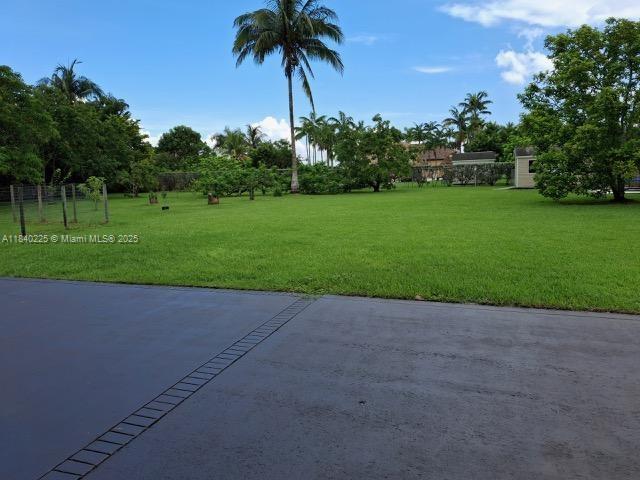 16961 SW 213th Ln, Miami, FL 33187 - view of green lawn with a patio area