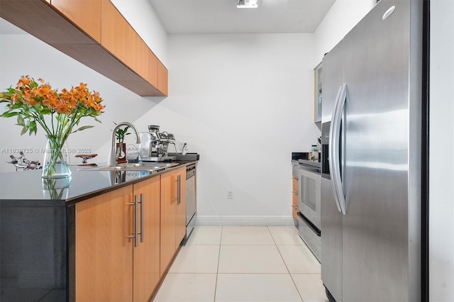 1750 SE Bayshore Dr Unit 2506, Miami, FL 33132 - kitchen with stainless steel appliances, dark countertops, light tile patterned flooring, and modern cabinets