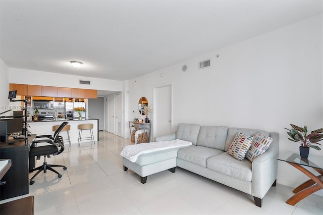 1750 SE Bayshore Dr Unit 2506, Miami, FL 33132 - living area featuring light tile patterned flooring and an office area