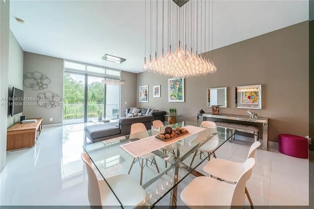 14951 Royal Oaks Ln Unit 102, North Miami, FL 33181 - tiled dining space with a chandelier and floor to ceiling windows