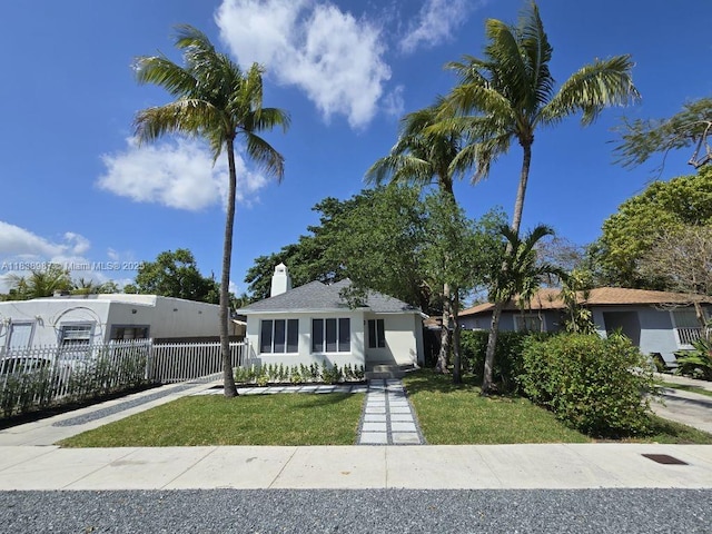1923 NW 48th St, Miami, FL 33142 - view of front of home with a chimney and stucco siding