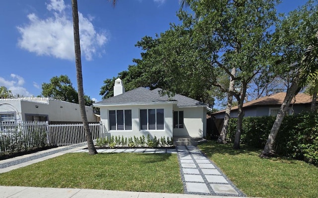 1923 NW 48th St, Miami, FL 33142 - bungalow-style home featuring a shingled roof, stucco siding, and a chimney