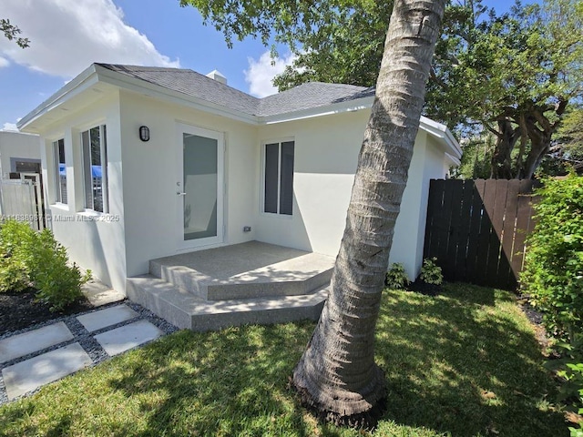 1923 NW 48th St, Miami, FL 33142 - ranch-style house with stucco siding and a shingled roof