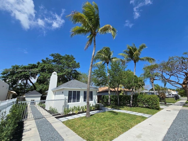 1923 NW 48th St, Miami, FL 33142 - view of front of home featuring a chimney and stucco siding