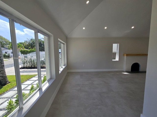 1923 NW 48th St, Miami, FL 33142 - unfurnished living room with vaulted ceiling and recessed lighting