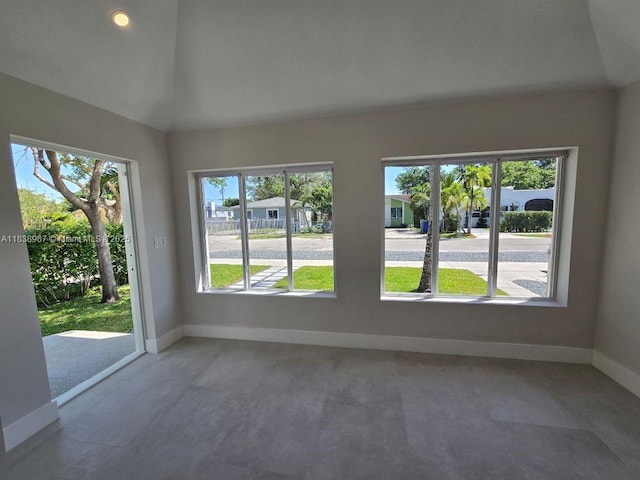 1923 NW 48th St, Miami, FL 33142 - unfurnished room with baseboards and vaulted ceiling