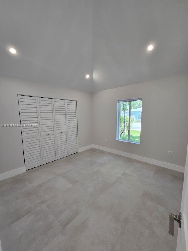 1923 NW 48th St, Miami, FL 33142 - spare room with lofted ceiling and recessed lighting