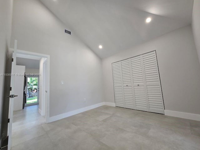 1923 NW 48th St, Miami, FL 33142 - unfurnished bedroom with high vaulted ceiling, recessed lighting, and a closet