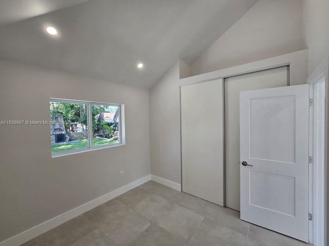1923 NW 48th St, Miami, FL 33142 - unfurnished bedroom featuring vaulted ceiling, recessed lighting, and a closet
