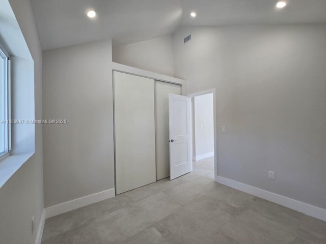 1923 NW 48th St, Miami, FL 33142 - unfurnished bedroom with recessed lighting, a closet, and high vaulted ceiling