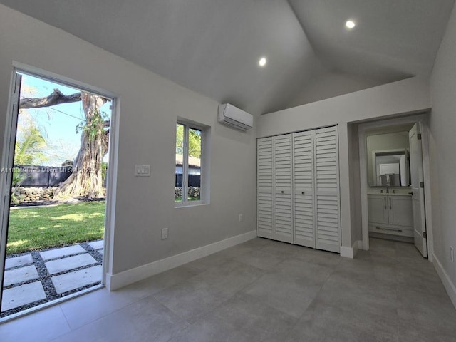 1923 NW 48th St, Miami, FL 33142 - unfurnished bedroom with a wall mounted AC, vaulted ceiling, access to exterior, recessed lighting, and a closet