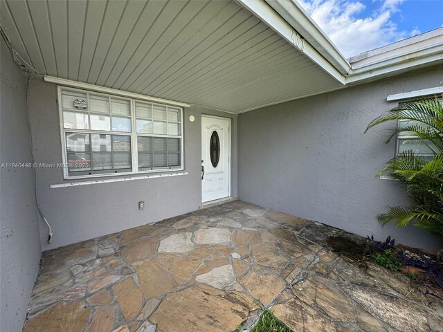 433 SW 28th Ave, Fort Lauderdale, FL 33312 - doorway to property with stucco siding