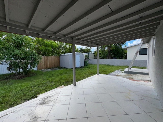 433 SW 28th Ave, Fort Lauderdale, FL 33312 - fenced backyard featuring a storage shed and a patio area