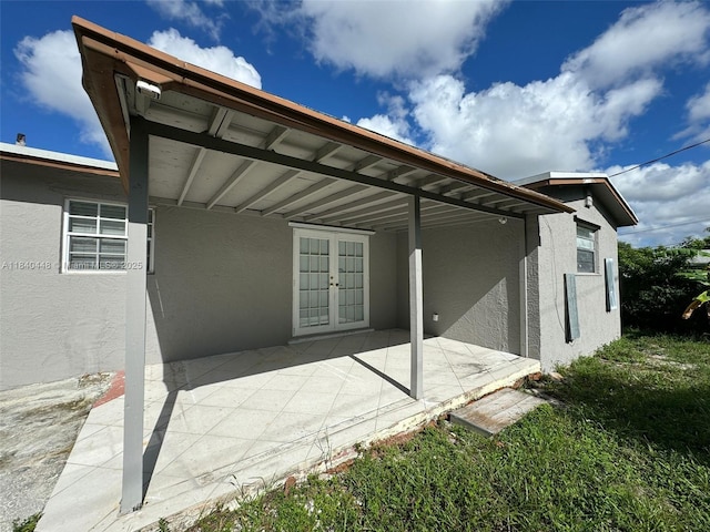 433 SW 28th Ave, Fort Lauderdale, FL 33312 - rear view of house with stucco siding, a patio area, and french doors