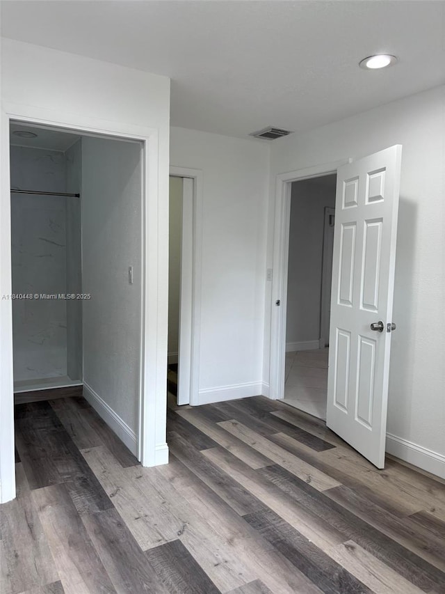433 SW 28th Ave, Fort Lauderdale, FL 33312 - unfurnished bedroom with wood finished floors, a closet, and recessed lighting