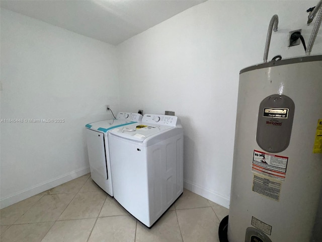 433 SW 28th Ave, Fort Lauderdale, FL 33312 - laundry room featuring electric water heater, washing machine and dryer, and light tile patterned floors
